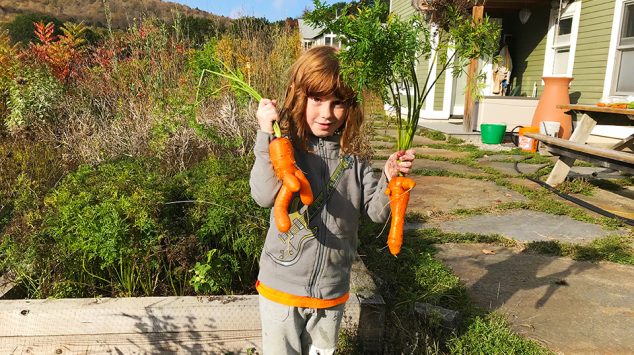 Lucy in the Stowe garden with carrots